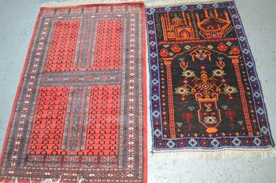 Lot 484 - A Middle Eastern prayer mat depicting mosques...