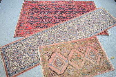Lot 485 - Two Middle Eastern rugs one with with a red...
