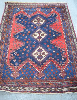 Lot 488 - An Iranian Sirjan wool rug with red and blue...
