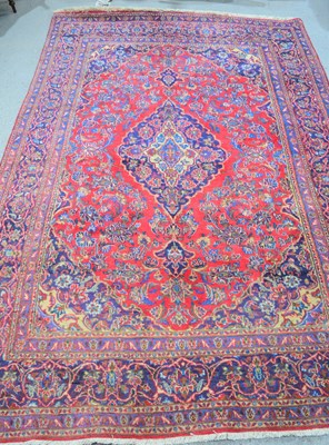 Lot 489 - An Iranian wool rug with purple and blue...