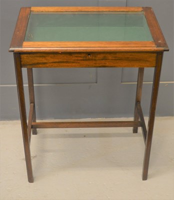 Lot 534 - A 1930s oak display cabinet table