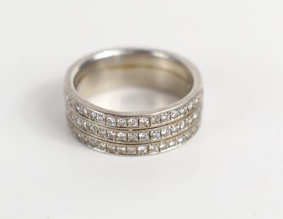 Lot 253 - A platinum and diamond three row full eternity...