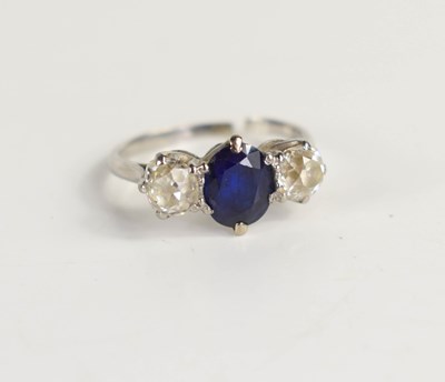 Lot 263 - A white gold, diamond and sapphire three stone...