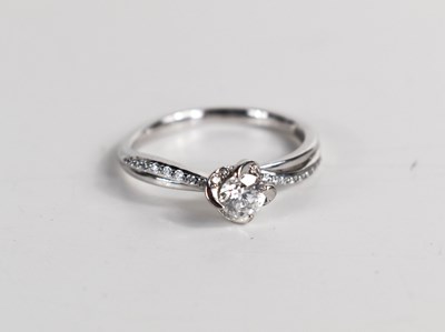 Lot 133 - A 18ct gold and diamond solitaire ring, the...