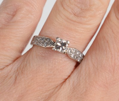 Lot 75 - An 18ct white gold and diamond ring, the...