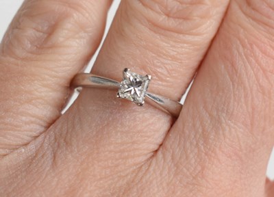 Lot 234 - An 18ct gold solitaire ring, with princess cut...