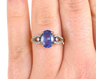 Lot 62 - An 18ct gold, tanzanite and diamond ring, the...