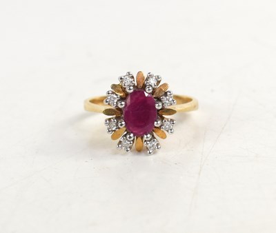 Lot 182 - A 14ct gold, ruby and diamond flowerhead form...