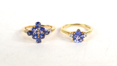 Lot 143 - A 14ct gold and blue topaz cluster ring, with...