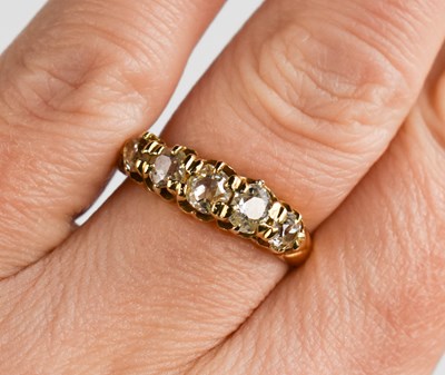 Lot 89 - An 18ct gold and diamond ring, the five...
