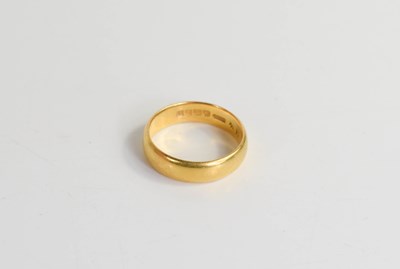 Lot 253 - A 22ct gold wedding band, Birmingham 1921,...