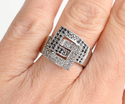 Lot 262 - A modernist style 9ct white gold ring set with...
