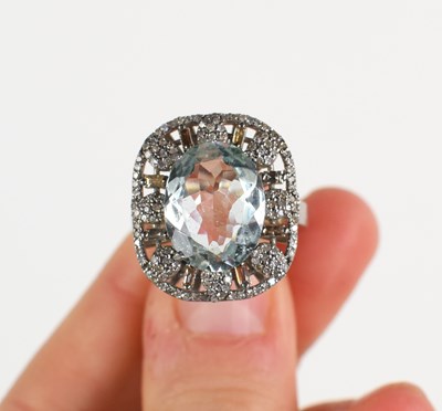 Lot 259 - An ornate silver dress ring set with a central...
