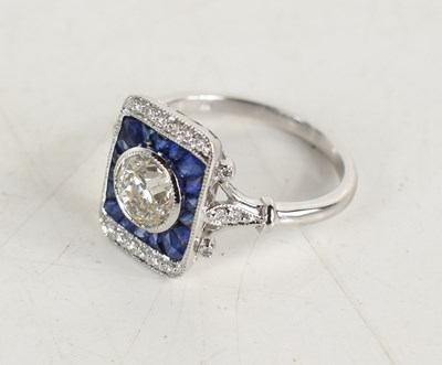 Lot 283 - An 18ct white gold target-style ring set with...