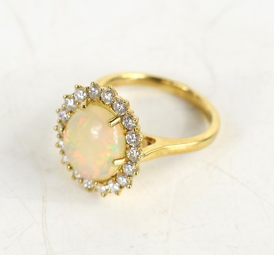 Lot 271 - A 9ct yellow gold cluster ring set with an...