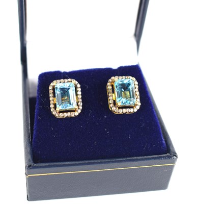 Lot 215 - A pair of silver gilt stud earrings set with...