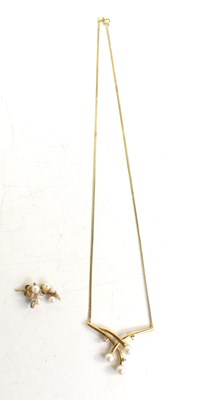 Lot 139 - A 9ct gold, pearl and diamond set pendant...