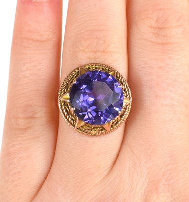 Lot 61 - A 12ct Egyptian gold and amethyst dress ring,...