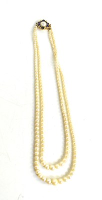 Lot 214 - A 9ct gold, enamel and pearl double string...