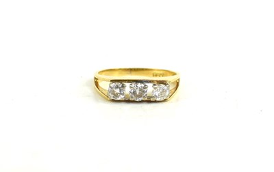 Lot 233 - An 18ct gold and three stone diamond ring,...