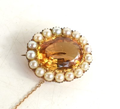 Lot 33 - A gold plated citrine and pearl antique brooch...