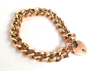 Lot 255 - A 9ct gold chain link bracelet, with a heart...