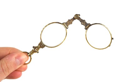Lot 80 - A pair of late Georgian gold plated folding...