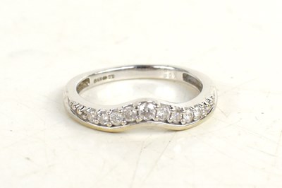 Lot 220 - A 9ct white gold and diamond wedding band,...