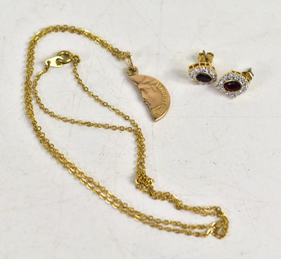 Lot 105 - A 9ct gold pendant 'half sun', 2.52g, with a...