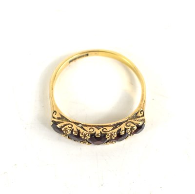 Lot 32 - A 9ct gold and garnet ring, the five graduated...