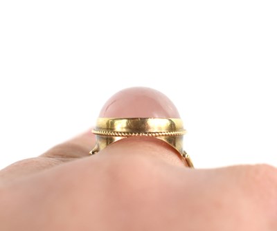 Lot 43 - A 9ct gold and rose quartz cabochon dress ring,...
