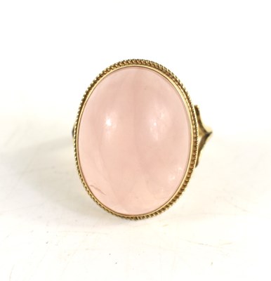Lot 43 - A 9ct gold and rose quartz cabochon dress ring,...