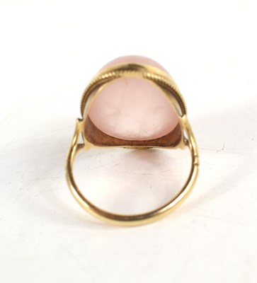 Lot 43 - A 9ct gold and rose quartz cabochon dress ring,...