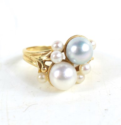 Lot 22 - A 14ct gold and pearl ring, set with a white...
