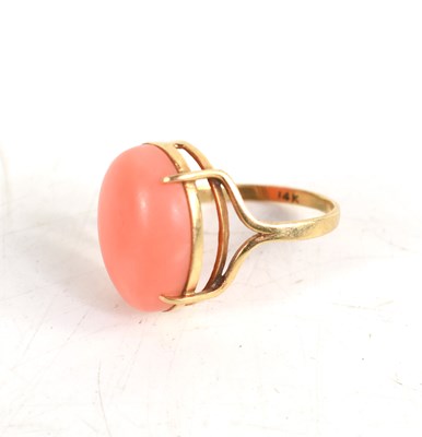 Lot 23 - A 14ct gold and coral cabochon set ring, size...