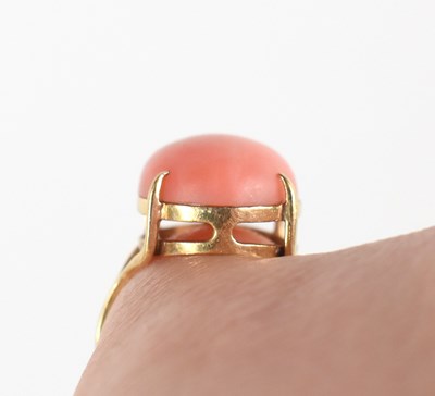 Lot 44 - A 14ct gold and coral cabochon set ring, size...