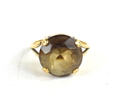 Lot 26 - A 9ct gold and smoky quartz dress ring, the...