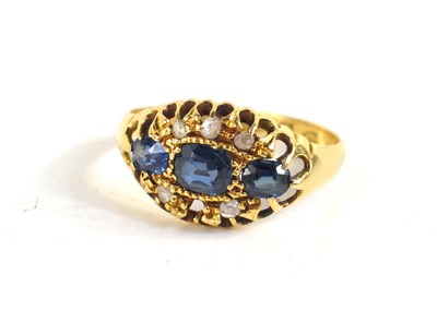 Lot 38 - An 18ct gold, sapphire and diamond ring, the...