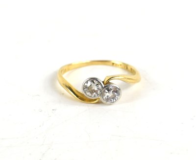 Lot 39 - An 18ct gold and diamond toi et moi ring, the...