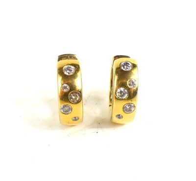 Lot 43 - A pair of 9ct gold and paste set half hoop...