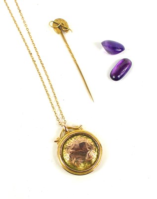 Lot 179 - A 9ct gold pendant necklace, engraved with a...