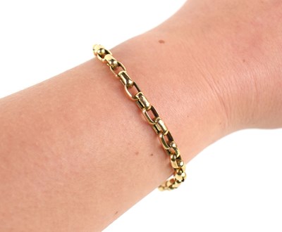 Lot 145 - A 9ct gold oval chain link bracelet, with crab...