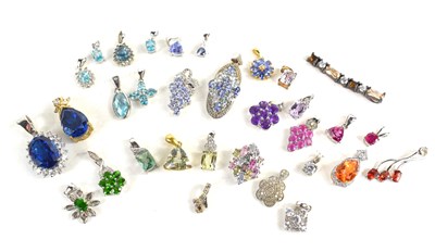 Lot 129 - A large selection of silver pendants, all set...