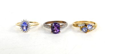 Lot 206 - A 9ct gold, amethyst and diamond ring, size O,...