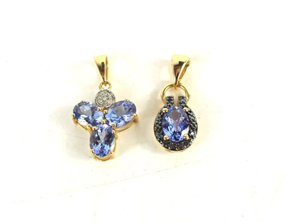 Lot 152 - Two 10ct gold and tanzanite set pendants, one...