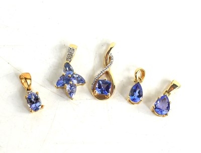 Lot 169 - Five 10ct gold and tanzanite set pendants, of...