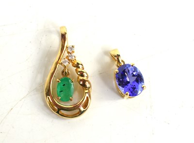 Lot 150 - An 18ct gold and tanzanite oval pendant and a...