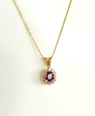 Lot 189 - An 18ct gold, ruby and diamond pendant...