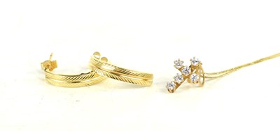 Lot 63 - A 9ct gold and diamond cruciform pendant...