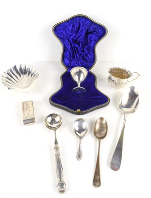 Lot 339 - A group of silver to include an egg cup in its...